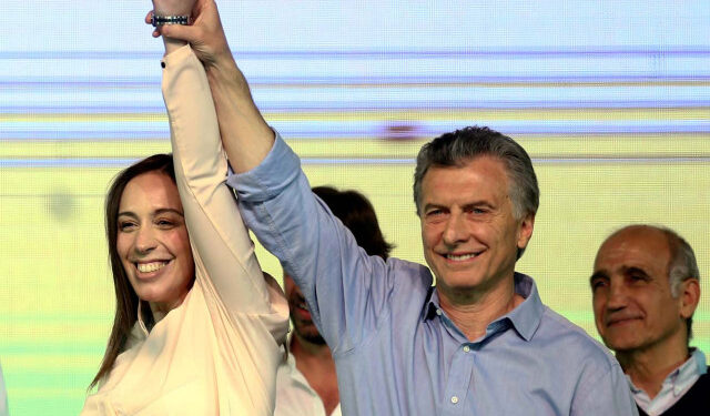 Argentina's President Mauricio Macri and Buenos Aires' governor Maria Eugenia Vidal hold hands as they celebrate at their campaign headquarters in Buenos Aires, Argentina October 22, 2017.  REUTERS/Marcos Brindicci