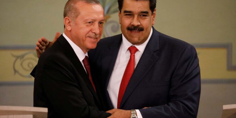 Turkish President Tayyip Erdogan and Venezuela's President Nicolas Maduro attend a news conference after an agreement-signing ceremony between Turkey and Venezuela at Miraflores Palace in Caracas, Venezuela December 3, 2018. REUTERS/Manaure Quintero