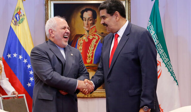 Venezuela's President Nicolas Maduro and Iran's Foreign Minister Mohammad Javad Zarif shake hands during their meeting in Caracas, Venezuela July 20, 2019. Miraflores Palace/Handout via REUTERS ATTENTION EDITORS - THIS PICTURE WAS PROVIDED BY A THIRD PARTY.