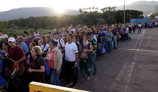 People walk on the Simon Bolivar cross-border bridge between Venezuela and Colombia, on the Venezuelan side of the border, as seen from Cucuta, Colombia June 8, 2019. REUTERS/Juan Pablo Bayona NO RESALES. NO ARCHIVES.