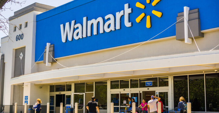 May 11, 2018 Mountain View / CA/ USA - People going in and coming out of a Walmart store on a sunny day, south San Francisco bay area