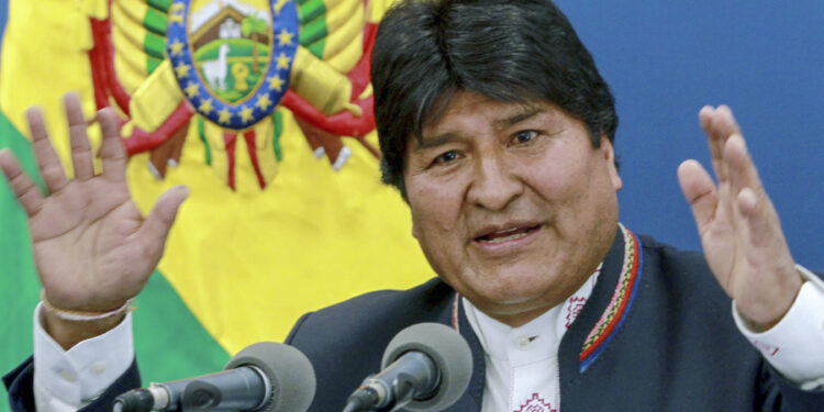 Handout picture relased by the Bolivian Presidency of Bolivian President Evo Morales speaking during a press conference at the Casa Grande del Pueblo (Great House of the People) in La Paz, on August 13, 2019. - Argentina's President Mauricio Macri defeat by populist candidate Alberto Fernandez in the  primary elections last Sunday, is a "rebellion" against the IMF's economic model, Bolivian president Evo Morales said on Tuesday, worried about the repercussions on the economy of his country. (Photo by HO / Bolivian Presidency / AFP) / RESTRICTED TO EDITORIAL USE - MANDATORY CREDIT "AFP PHOTO / BOLIVIAN PRESIDENCY " - NO MARKETING NO ADVERTISING CAMPAIGNS - DISTRIBUTED AS A SERVICE TO CLIENTS