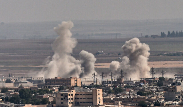 Smoke rises from the Syrian town of Ras al-Ain, in a picture taken from the Turkish side of the border in Ceylanpinar on October 11, 2019, on the third day of Turkey's military operation against Kurdish forces. - Turkey will not stop its operation against Kurdish militants in northern Syria, President Recep Tayyip Erdogan said Friday, dismissing what he called "threats" from other countries. (Photo by Ozan KOSE / AFP)