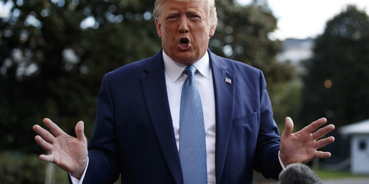 President Donald Trump talks to reporters on the South Lawn of the White House, Friday, Oct. 4, 2019, in Washington. (AP Photo/Evan Vucci)