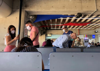 People wear protective masks in response to the spreading of coronavirus (COVID-19), at Simon Bolivar international airport in Maiquetia, Venezuela March 15, 2020. REUTERS/Carlos Jasso