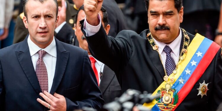 Venezuelan President Nicolas Maduro (R) and Vicepresident Tareck El Aissami greet supporters before the ceremony where Maduro will deliver a speech reviewing his year in office at the Supreme Court of Justice in Caracas on January 15, 2017. - Venezuela's leader Nicolas Maduro angered his opponents Sunday by refusing to deliver his annual presidential address in the legislative chamber, fanning tensions in the volatile country. (Photo by JUAN BARRETO / AFP)        (Photo credit should read JUAN BARRETO/AFP via Getty Images)