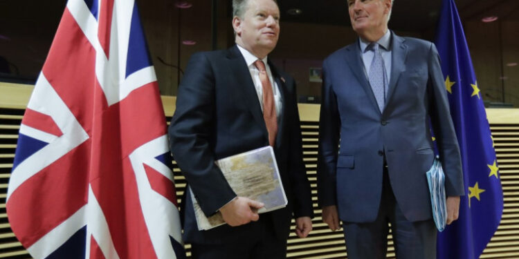 European Union chief Brexit negotiator Michel Barnier (R) and the British Prime Minister's Europe adviser David Frost pose for a photograph at start of the first round of post-Brexit trade deal talks between the EU and the United Kingdom, in Brussels on March 2, 2020. (Photo by Olivier HOSLET / POOL / AFP)