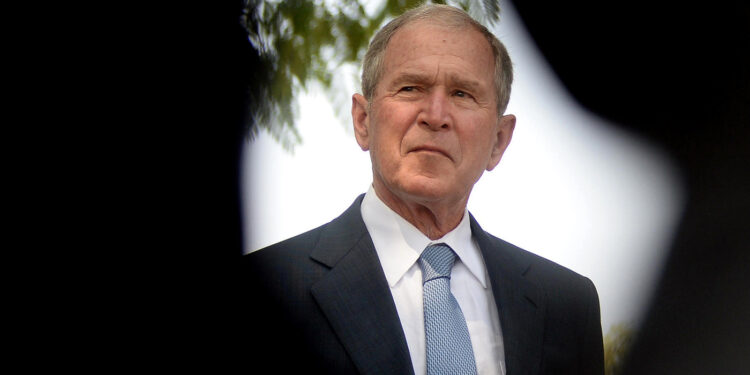 Former President George W. Bush visits the Theresanyo primary school in Gaborone, Botswana, during an official visit on April 4