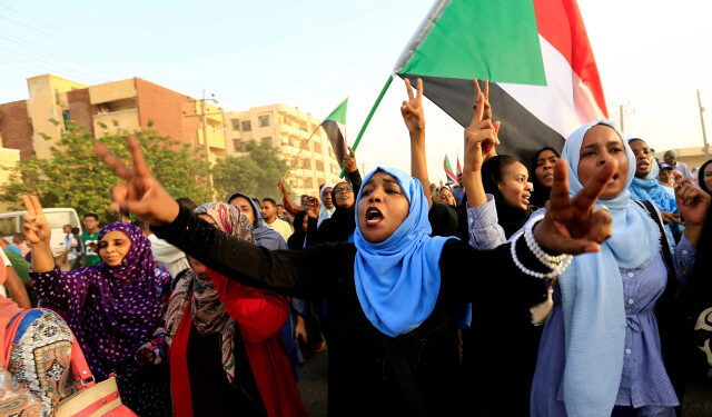 REFILE - REMOVING ERRONEOUS WORD  Sudanese protesters march during a demonstration to commemorate 40 days since the sit-in massacre in Khartoum North, Sudan July 13, 2019. REUTERS/Mohamed Nureldin Abdallah - RC18149625F0