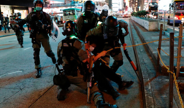 Riot police detain an anti-government protester during a protest at Mong Kok, in Hong Kong, China May 10, 2020. REUTERS/Tyrone Siu