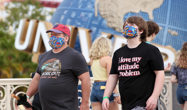 Visitors arrive at Universal Studios theme park on the first day of reopening after the shutdown during the coronavirus pandemic, on June 5, 2020, in Orlando, Florida. (Photo by Gregg Newton / AFP)