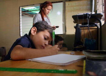 A boy does his homework after the closing of schools during the nationwide quarantine due to coronavirus disease (COVID-19) outbreak in San Cristobal, Venezuela March 20, 2020. Pictures tajen March 20, 2020 REUTERS/Carlos Eduardo Ramirez