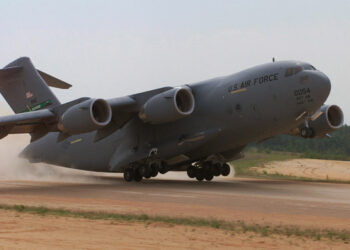 A C-17 Globemaster, 446th Airlift Wing, McChord AFB, Wa. conducts an assult landing at Holland landing zone, Ft. Bragg, N.C.  onTuesday, May 9, 2000. During Rodeo 2000, teams from all over the world will compete in areas including airdrop, aerial refueling, aircraft navigation, special tactics, short field landings, cargo loading, engine running on/offloads, aeromedical evacuations and security forces operations.  From May 6 to 13, over 80 aircraft representing more than 100 teams from 17 countries will bring in about 3,500 competitors, observers, umpires, and support people to Pope AFB, NC.  1st Combat Camera Image by Technical Sergeant James E. Lotz