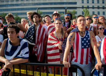 Fans react to the USA's loss to Belgium in the 2014 FIFA World Cup on Freedom Plaza in Washington, DC, July 1, 2014. Kevin De Bruyne and Romelu Lukaku's extra time goals fired Belgium past the United States with a thrilling 2-1 win and into the World Cup quarter-finals.       AFP PHOTO / Jim WATSON