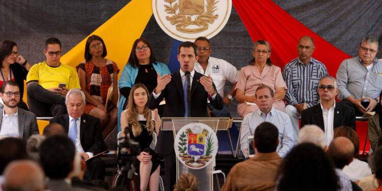 Venezuela's opposition leader Juan Guaido, who many nations have recognized as the country's rightful interim ruler, gestures as he speaks during a meeting in Caracas, Venezuela February 21, 2020. REUTERS/Manaure Quintero