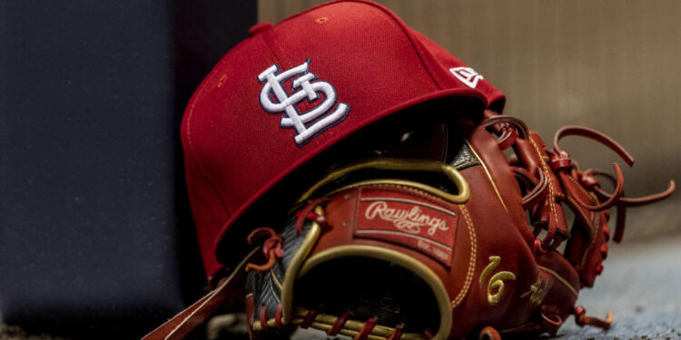 MILWAUKEE, WI - MARCH 29: St. Louis Cardinals Second base Kolten Wong (16) hat and glove sit on the dugout step during a MLB game between the St. Louis Cardinals and the Milwaukee Brewers on March 29th, 2019 at the Miller Park in Milwaukee, WI. (Photo by Dan Sanger/Icon Sportswire via Getty Images)