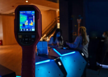 A camera shows body temperatures of customers at a cinema lobby during the first day of re-opening the theatres after COVID-19 in Shanghai on July 20, 2020. - Hundreds of cinemas reopened in scores of Chinese cities on July 20 following a nearly six-month nationwide shutdown due to the coronavirus. But the threat from COVID-19 remains in the air, with cinemas in Beijing still closed for now. (Photo by Hector RETAMAL / AFP)