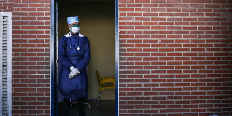 TOPSHOT - A doctor wears a face mask as a preventive measure in the face of the global COVID-19 coronavirus pandemic, at the Ana Francisca Perez de Leon hospital, in Caracas, on March 14, 2020. - Venezuela requires a 'mandatory quarantine' for all travelers from Europe who arrived in the country in March, one day after confirming their first two cases of coronavirus. (Photo by Cristian Hernandez / AFP) (Photo by CRISTIAN HERNANDEZ/AFP via Getty Images)