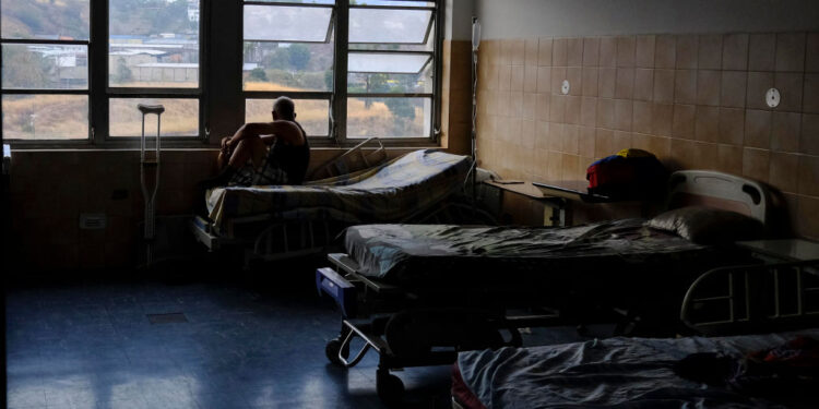 TOPSHOT - A patient looks out from a window at Miguel Perez Carreno hospital, in Caracas, during the worst power outage in Venezuela's history, on March 8, 2019. - Venezuela's government struggled to cope Friday with a massive electricity blackout that paralyzed much of the country as President Nicolas Maduro blamed the chaos on US sabotage. (Photo by MATIAS DELACROIX / AFP) (Photo by MATIAS DELACROIX/AFP via Getty Images)