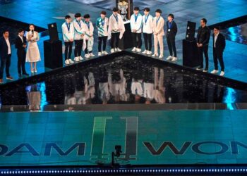 South Korea's Damwon team are seen during their award after win against China's Suning team during the League of Legends World Video Game Championships final at SAIC Pudong Football Stadium in Shanghai on October 31, 2020. (Photo by HECTOR RETAMAL / AFP)