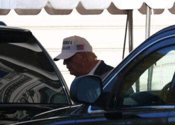 U.S. President Donald Trump enters the Presidential motorcade before traveling to an undisclosed location at the south portico of the White House in Washington, U.S., November 8, 2020. REUTERS/Tom Brenner