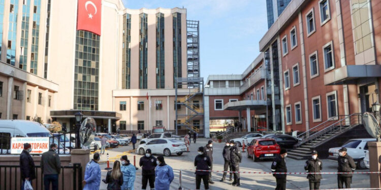 Police cordon off the area in front of the privately-run Sanko University Hospital in Gaziantep after nine patients, all infected with Covid-19, died in a fire on December 19, 2020. (Photo by Kadir Gunes / Demiroren News Agency (DHA) / AFP)