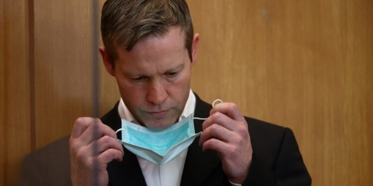 Stephan Ernst, who is accused of murdering politician Walter Luebcke, takes off his face mask at his trial at the Oberlandesgericht Frankfurt courthouse, in Frankfurt, Germany August 5, 2020. (Photo by KAI PFAFFENBACH / POOL / AFP)