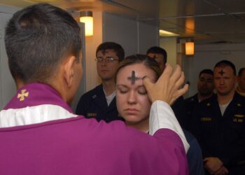 080206-N-7869M Atlantic Ocean (February 6, 2008) - Electronics Technician 3rd Class Leila Tardieu receives the sacramental ashes during an Ash Wednesday celebration aboard the multi-purpose amphibious assault ship USS Wasp (LHD 1). Wasp is currently participating in a number of preparatory evolutions prior to entering a regularly-scheduled dry dock period. U.S. Navy photo by Mass Communication Specialist 3rd Class Brian May (RELEASED)