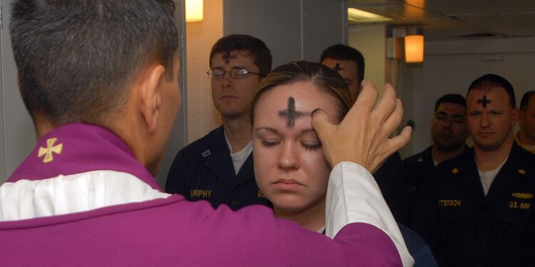 080206-N-7869M Atlantic Ocean (February 6, 2008) - Electronics Technician 3rd Class Leila Tardieu receives the sacramental ashes during an Ash Wednesday celebration aboard the multi-purpose amphibious assault ship USS Wasp (LHD 1). Wasp is currently participating in a number of preparatory evolutions prior to entering a regularly-scheduled dry dock period. U.S. Navy photo by Mass Communication Specialist 3rd Class Brian May (RELEASED)