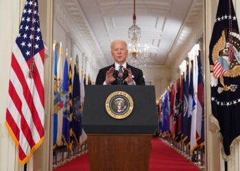 US President Joe Biden speaks on the anniversary of the start of the Covid-19 pandemic, in the East Room of the White House in Washington, DC on March 11, 2021. (Photo by MANDEL NGAN / AFP)