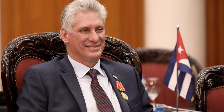 Cuba's President Miguel Diaz-Canel Bermudez (C) listens to Vietnamese Prime Minister Nguyen Xuan Phuc (not pictured) during a meeting at the Government Office in Hanoi on November 9, 2018. (Photo by LUONG THAI LINH / POOL / AFP)