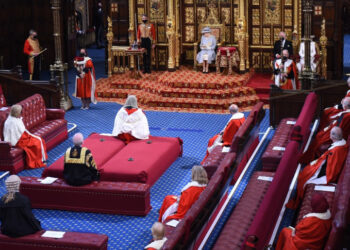 Britain's Queen Elizabeth II reads the Queen's Speech on the The Sovereign's Throne in the socially distanced House of Lords chamber, during the State Opening of Parliament at the Houses of Parliament in London on May 11, 2021, which is taking place with a reduced capacity due to Covid-19 restrictions. - The State Opening of Parliament is where Queen Elizabeth II performs her ceremonial duty of informing parliament about the government's agenda for the coming year in a Queen's Speech. (Photo by Eddie MULHOLLAND / POOL / AFP)