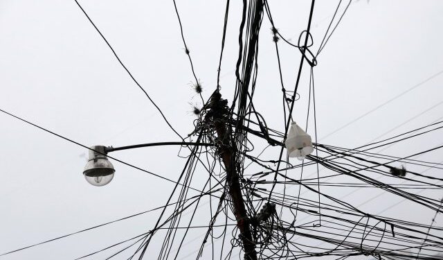 A light post with electrical cables is seen during a blackout in the Catia slum in Caracas, Venezuela March 8, 2019. REUTERS/Carlos Jasso