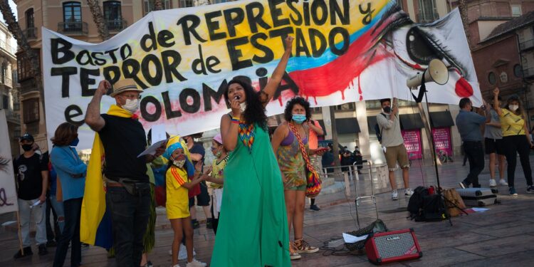 MALAGA, SPAIN - 2021/05/22: A Colombian protester shouts slogans through a megaphone  during the demonstration at Plaza de la Constitucion square.
Colombian residents in Malaga take to the streets again in solidarity with the Colombians and against the government of President Iván Duque as negotiations continue between the Colombian government and the committee of the national strike after protests and violent clashes erupted in the country. (Photo by Jesus Merida/SOPA Images/LightRocket via Getty Images)