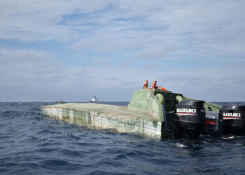 The U.S. Coast Guard Cutter Midgett (WMSL 757) seen with a low-profile go-fast vessel interdicted in international waters of the Eastern Pacific Ocean July 26, 2019. Midgett crew members boarded the suspected drug-smuggling vessel seizing more than 2,100 pounds of cocaine during the cutter’s transit from the Pascagoula shipyard where Midgett was built to the cutter’s future homeport in Honolulu where the cutter is scheduled for commissioning during a dual-commissioning ceremony August 24, 2019 with Midgett’s sister ship the Coast Guard Cutter Kimball (WMSL 756). U.S. Coast Guard photo.