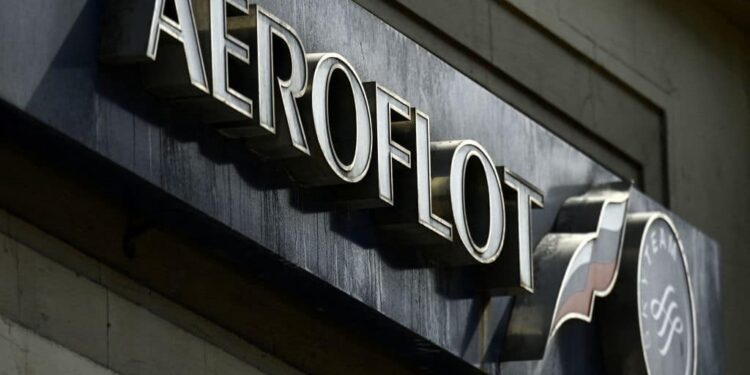 The logo of Russia's airline Aeroflot is pictured on its tickets office in central Moscow on April 12, 2021. (Photo by Kirill KUDRYAVTSEV / AFP) (Photo by KIRILL KUDRYAVTSEV/AFP via Getty Images)