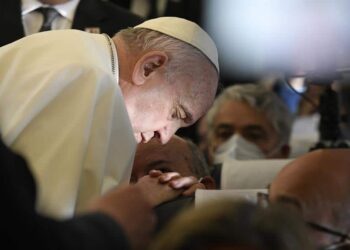 A handout picture provided by the Vatican Media shows Pope Francis praying aboard the plane on his way to Malta International Airport, ahead of his apostolic visit in Luqa, Malta, 02 April 2022. Pope Francis departs for a two-day trip to Malta.