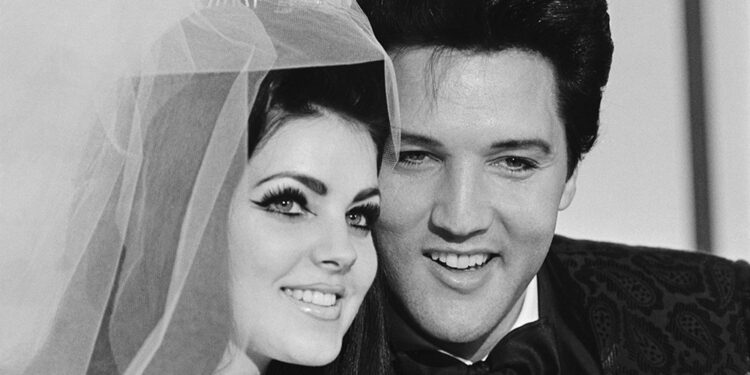 01 May 1967, Las Vegas, Nevada, USA --- Original caption: 5/1/1967-Las Vegas, NV-  Singer Elvis Presley and his bride Priscilla Ann Beaulieu, pose for photograph following their wedding at the Aladdin Hotel. Presley, 31, met his 22-year-old bride when he was stationed in Germany during his Army service. --- Image by © Bettmann/CORBIS