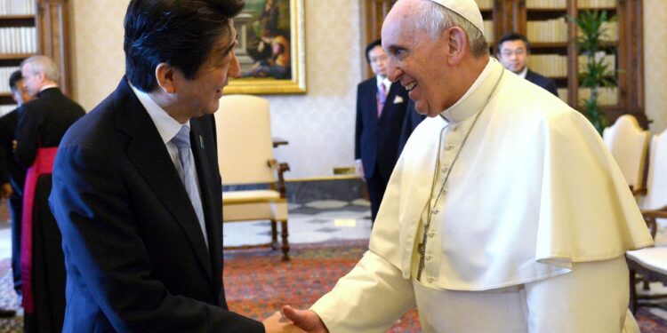 Pope Francis shakes hands with Japan's Prime Minister Shinzo Abe (L) during a private audience at the Vatican June 6, 2014. 
REUTERS/Alberto Pizzoli/Pool (VATICAN - Tags: RELIGION POLITICS)