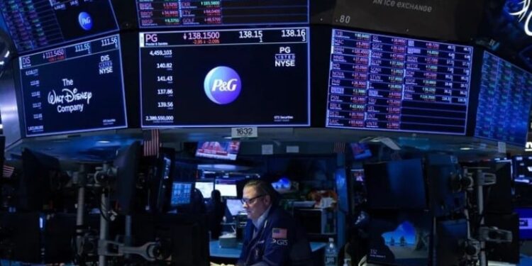 A trader works on the trading floor at the New York Stock Exchange (NYSE) in Manhattan, New York City, U.S., September 13, 2022. REUTERS/Andrew Kelly