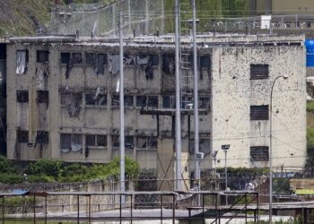 The partially destroyed facilities by gunfire of 'El Rodeo' prison is seen in Guatire outside Caracas June 19, 2011. The prisoners are being moved as gunbattles between inmates have killed at least 25 people in the latest riots to rock the overcrowded prison system. President Hugo Chavez's government announced this week a new Prisons Ministry to try to control chaos inside jails where inmates traffic drugs, carry guns, mastermind crime outside via telephones and control whole blocks by themselves. REUTERS/Carlos Garcia Rawlins (VENEZUELA - Tags: POLITICS CRIME LAW)