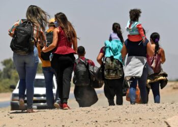 SAN LUIS, AZ - MAY 21: Migrants attempting to cross in to the U.S. from Mexico are detained by U.S. Customs and Border Protection at the border May 21, 2021 in San Luis, Arizona. (Photo by Nick Ut/Getty Images)