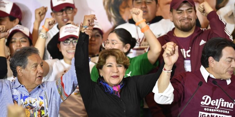 Delfina Gomez (C), candidate for governor for the State of Mexico for a coalition led by the ruling Morena political party, unofficially celebrates being elected governor of the State of Mexico in Toluca, Mexico State, on June 4, 2023. The vote is a test of the popularity of President Andres Manuel Lopez Obrador's ruling Morena party ahead of presidential elections next year. The State of Mexico is in many ways a microcosm of the country: half of its population lives in poverty. (Photo by CLAUDIO CRUZ / AFP)