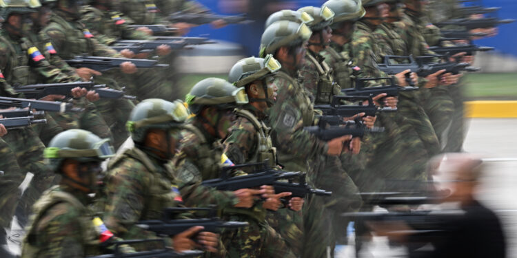 Soldiers of the Venezuelan Army march during a military parade to celebrate the 212th anniversary of the Venezuelan Independence in Caracas, on July 5, 2023. (Photo by Federico PARRA / AFP)