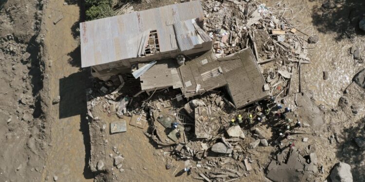 Aerial view of the site of a landslide in the Quetame municipality, Cundinamarca department, Colombia, on July 18, 2023. Rescue teams with drones searched for survivors Tuesday after a landslide triggered by heavy rains left at least 14 people dead and about a dozen missing in central Colombia, authorities said. (Photo by Daniel Munoz / AFP)