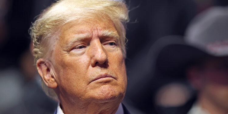 TULSA, OK - MARCH 18: Former United States President Donald Trump stands on the floor during the Division I Mens Wrestling Championship held at the BOK Center on March 18, 2023 in Tulsa, Oklahoma. (Photo by Shane Bevel/NCAA Photos via Getty Images)