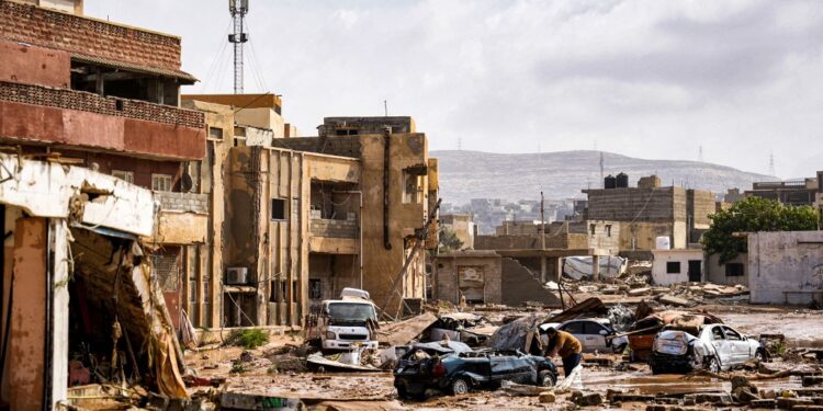 This handout picture provided by the office of Libya's Benghazi-based interim prime minister on September 11, 2023 shows a view of destroyed vehicles and damaged buildings in the eastern city of Derna, about 290 kilometres east of Benghazi, in the wake of the Mediterranean storm "Daniel". At least 150 people were killed when freak floods hit eastern Libya, officials said on September 11, after the storm's torrential rains battered Turkey, Bulgaria, and Greece. (Photo by The Press Office of Libyan Prime Minister / AFP) / === RESTRICTED TO EDITORIAL USE - MANDATORY CREDIT "AFP PHOTO / HO /MEDIA OFFICE OF LIBYAN PRIME MINISTER (BENGHAZI)" - NO MARKETING NO ADVERTISING CAMPAIGNS - DISTRIBUTED AS A SERVICE TO CLIENTS === / The erroneous mention[s] appearing in the metadata of this photo by - has been modified in AFP systems in the following manner: [Derna, about 290 kilometres east of Benghazi] instead of [Benghazi]. Please immediately remove the erroneous mention[s] from all your online services and delete it (them) from your servers. If you have been authorized by AFP to distribute it (them) to third parties, please ensure that the same actions are carried out by them. Failure to promptly comply with these instructions will entail liability on your part for any continued or post notification usage. Therefore we thank you very much for all your attention and prompt action. We are sorry for the inconvenience this notification may cause and remain at your disposal for any further information you may require.
