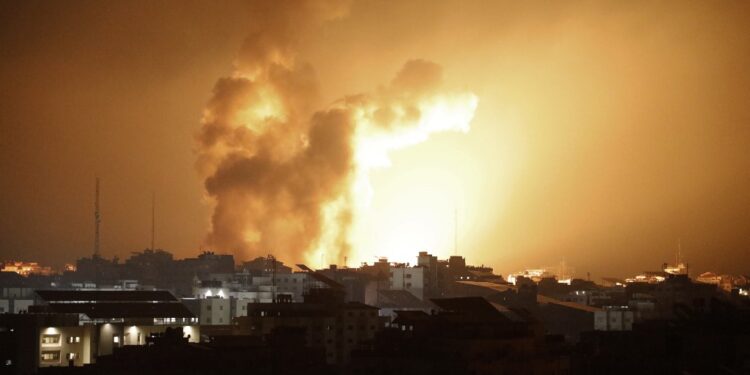 Fire and smoke rises above buildings during an Israeli air strike in Gaza City on October 8, 2023. At least 200 Israelis died in a surprise large-scale attack by the Palestinian militant group Hamas on October 7, 2023, the army said, as Prime Minister Benjamin Netanyahu vowed to reduce the group's Gaza hideouts to "rubble". (Photo by EYAD BABA / AFP)