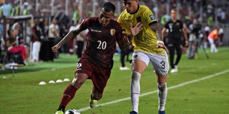 Venezuela's midfielder Romulo Otero (L) and Ecuador's defender Piero Hincapie fight for the ball during the 2026 FIFA World Cup South American qualification football match between Venezuela and Ecuador at the Monumental Stadium in Maturin, Venezuela, on November 16, 2023. (Photo by Federico Parra / AFP)