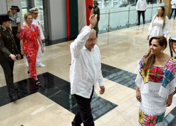 Mexico's President Andres Manuel Lopez Obrador waves before the inauguration of the Felipe Carrillo Puerto International Aiport in Tulum, Quintana Roo state, Mexico on December 1, 2023. (Photo by ALFREDO ESTRELLA / AFP)